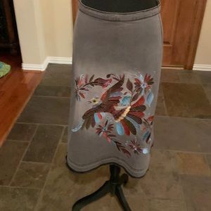 You will love this grey/black jean skirt with exceptional embroidered. Size M.